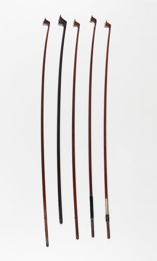 Four violin bow sticks and one cello bow stick