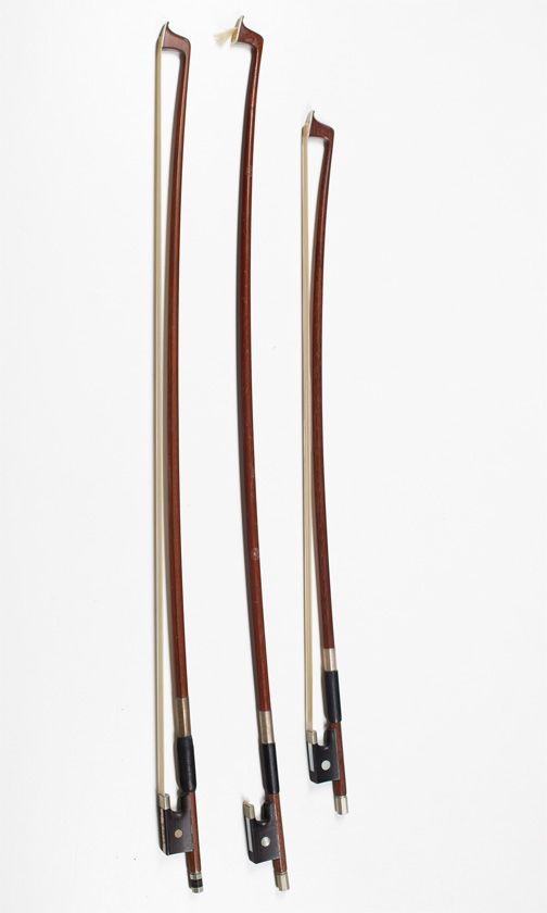 Three child’s violin bows