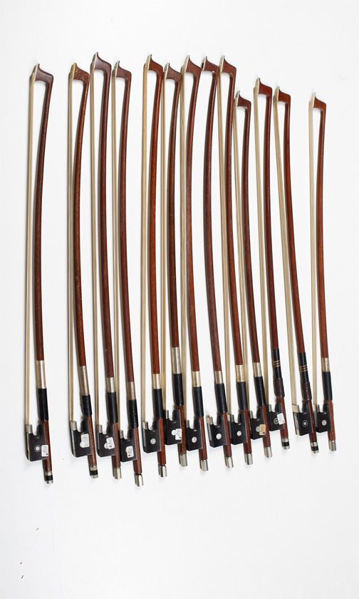 Thirteen child’s violin bows, varying lengths