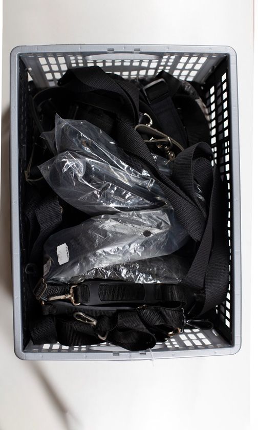 A large quantity of violin case straps