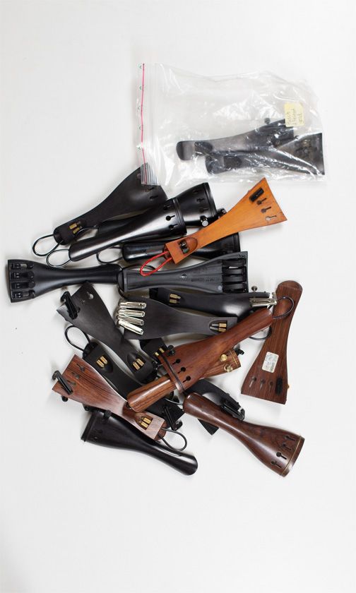 Twenty violin tailpieces, various sizes