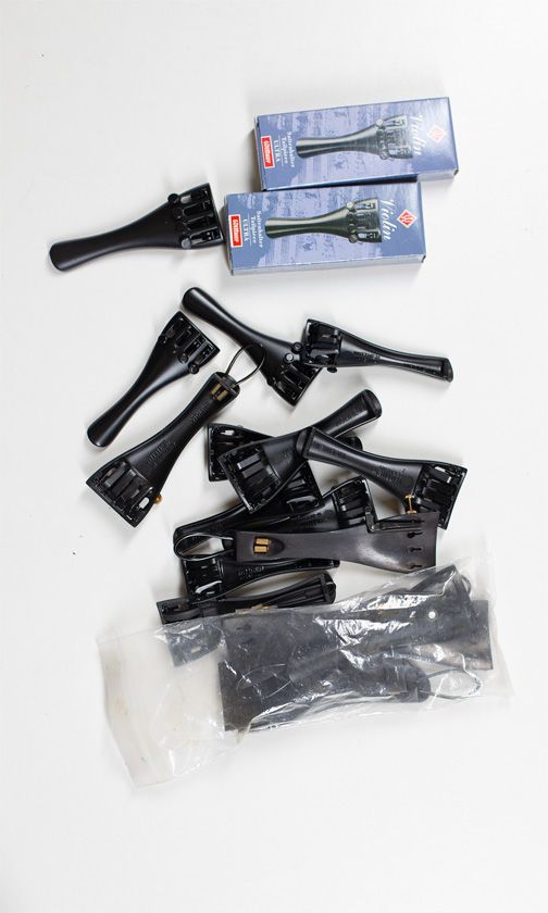 Twenty violin tailpieces, various sizes