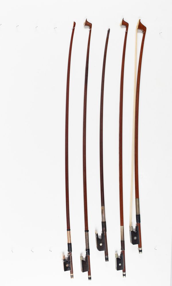 Three violin bows and two cello bows