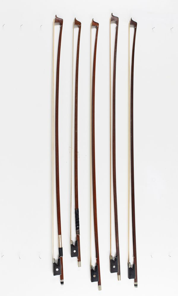 Four violin bows and one child's violin bow