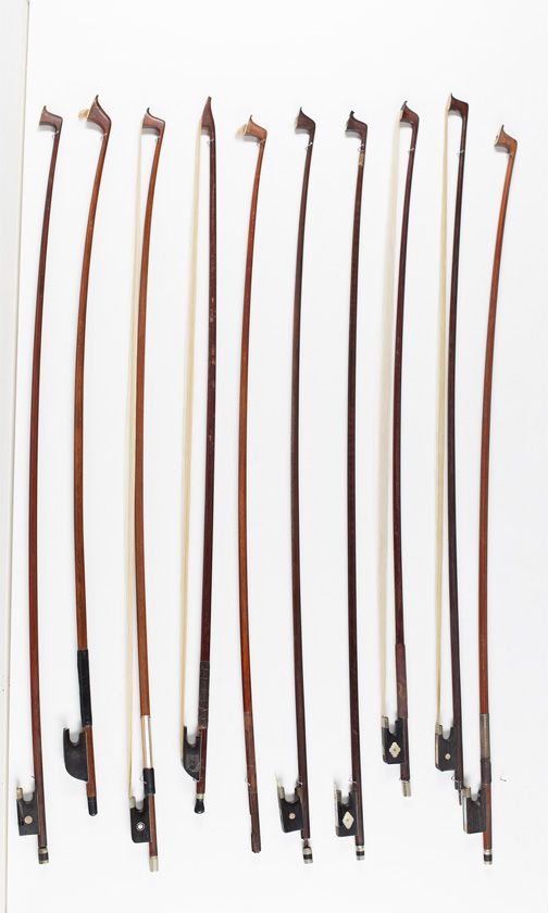 Eight violin bows and two child's violin bows, various sizes
