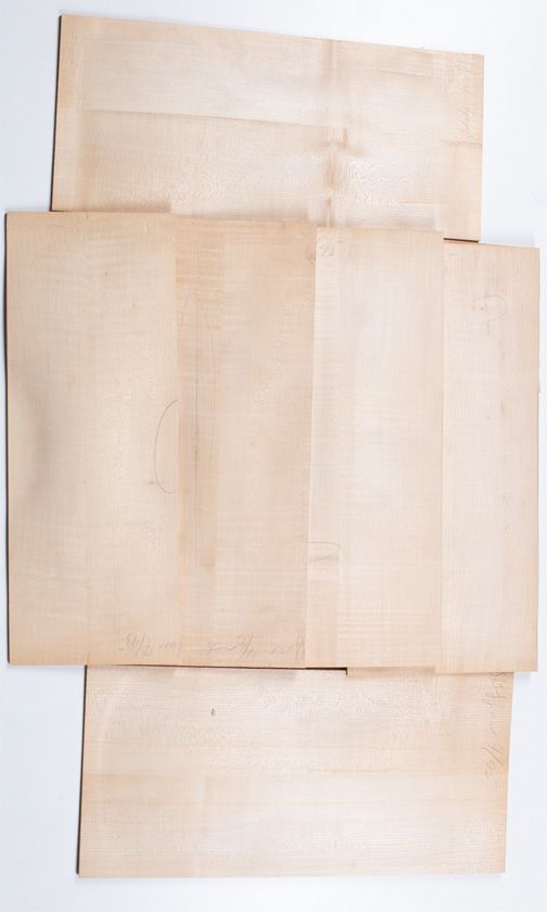 Seven maple child's violin backs