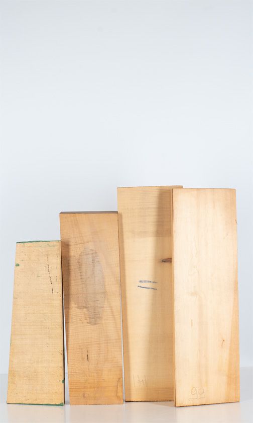 Two maple violin backs and six pieces of spruce