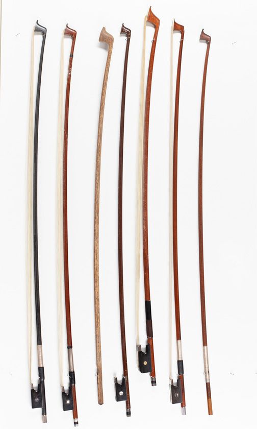 Four violin bows, one violin bow stick, one cello bow and one cello bow stick