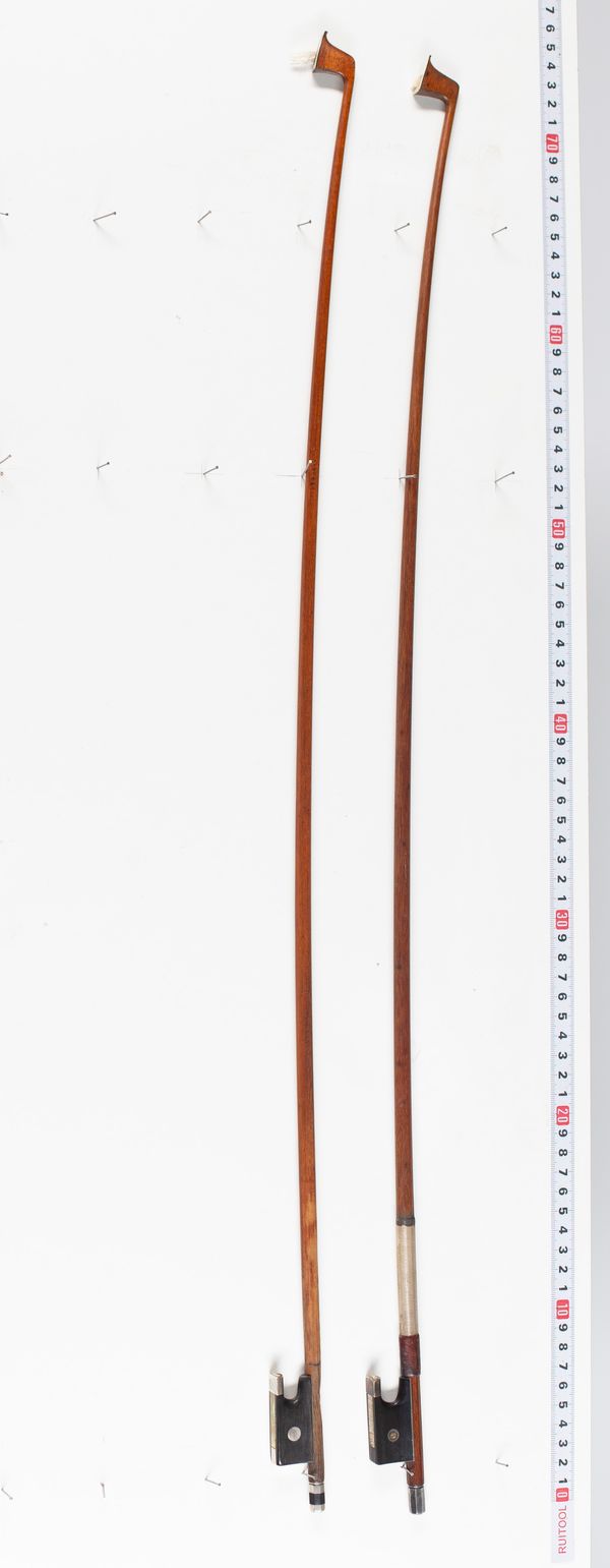 Two violin bows, varying lengths