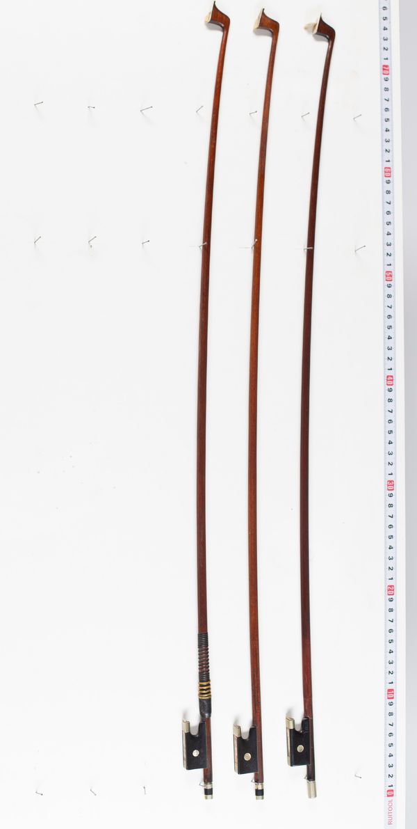 Three violin bows,  varying lengths