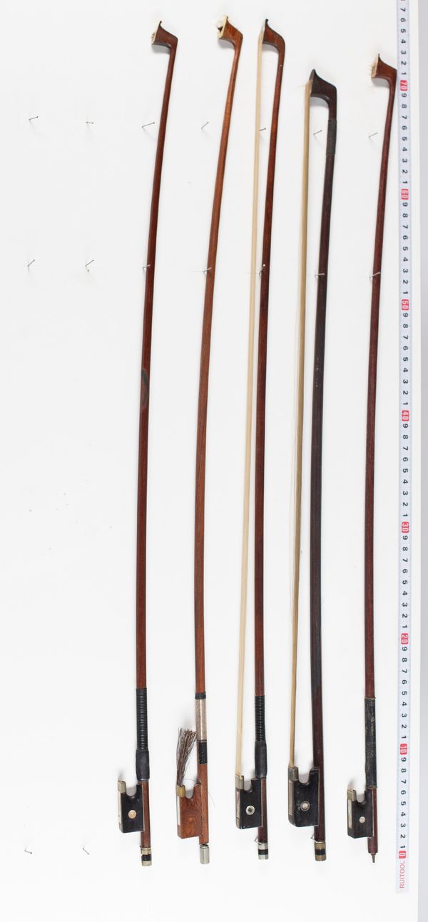 Four violin bows and one cello bow, varying lengths