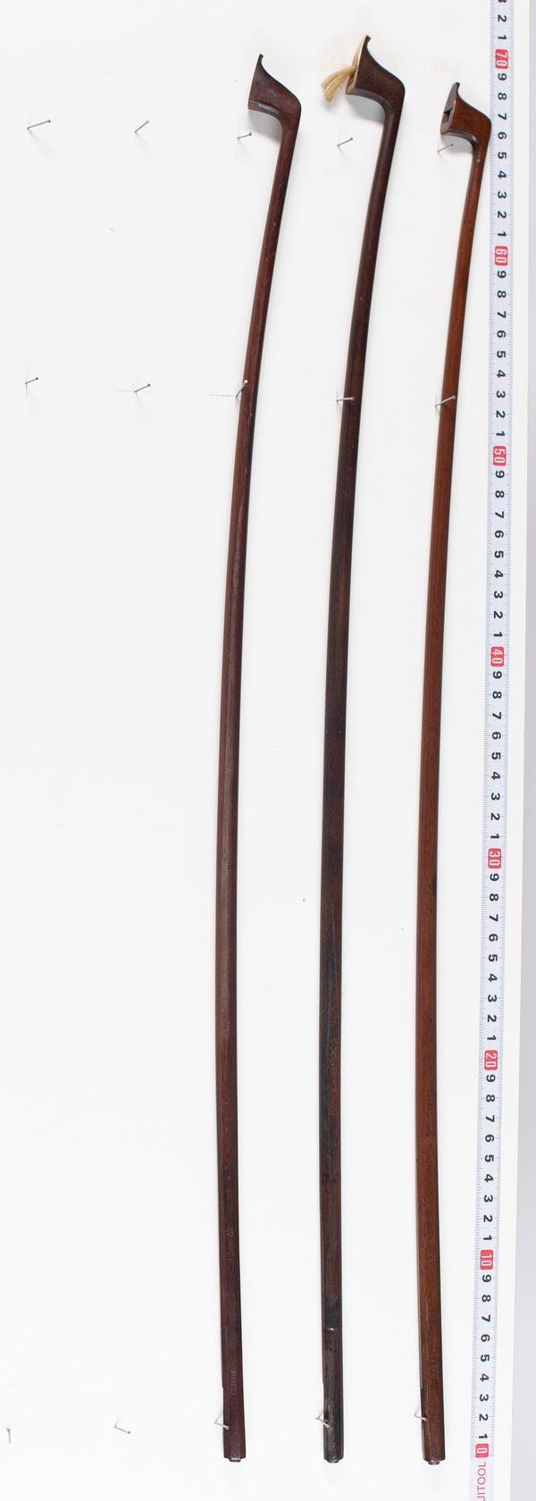 Three bow sticks branded Dodd, varying lengths