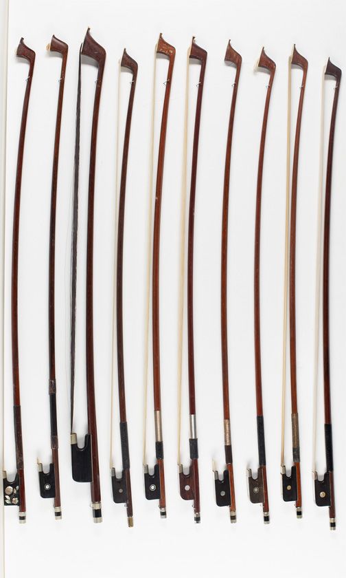Nine cello bows and one bass bow