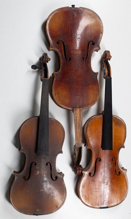 One violin and three child's violins