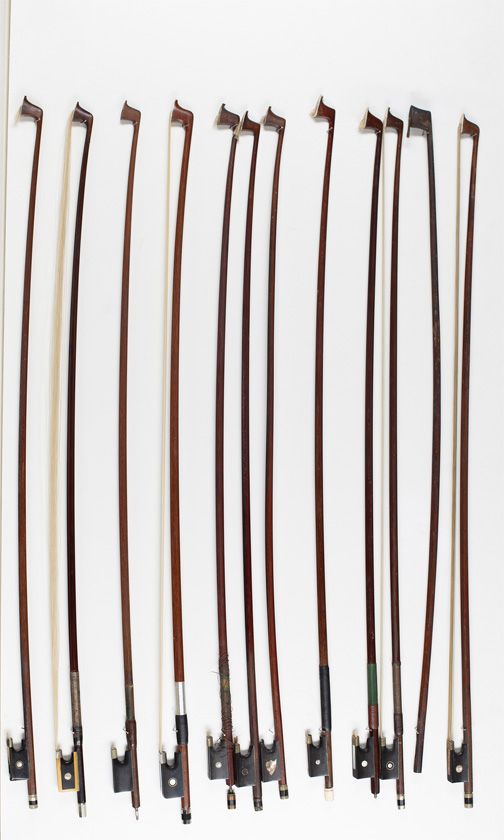 Eleven violin bows and one violin bow stick
