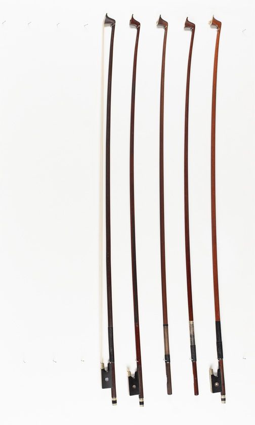 Three violin bows and two violin bow sticks