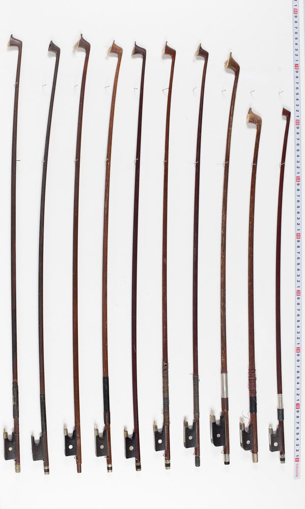 Twelve violin bows, one cello bow and two violin sticks, varying lengths