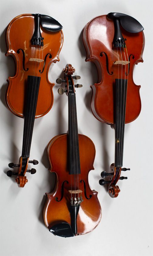 Three child's violins