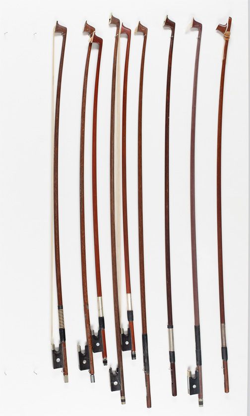 Two violin bows, three violin bow sticks and four child's violin bows