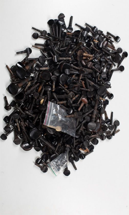 A large quantity of violin and cello pegs, various sizes