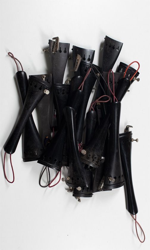 Nineteen cello tailpieces, various sizes