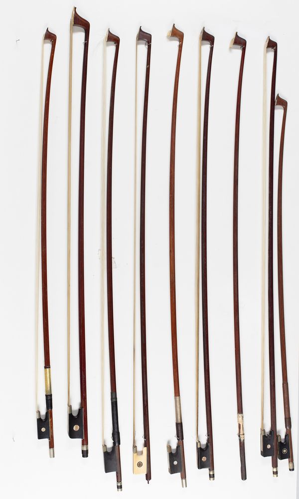 Seven violin bows, one cello bow and a bow stick, varying lengths