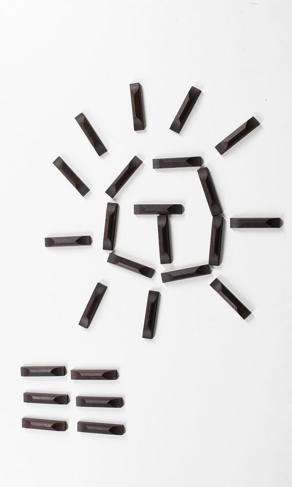 Twenty five ebony cello bottom saddles