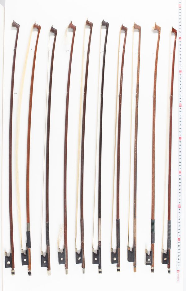 Eleven violin bows, varying lengths