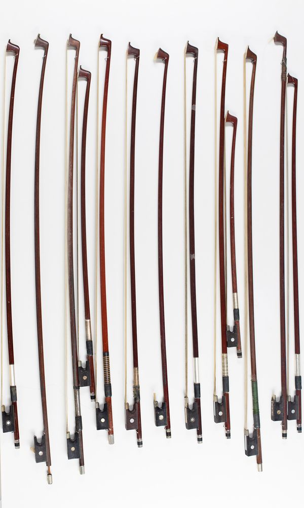 Thirteen violin bows, various sizes