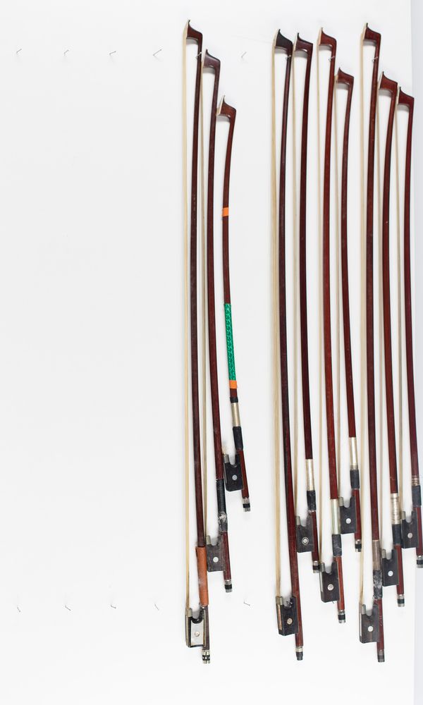 Ten violin bows, various sizes