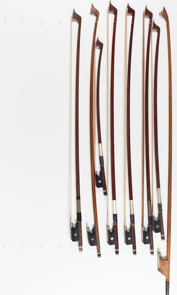 Eight cello bows, various sizes