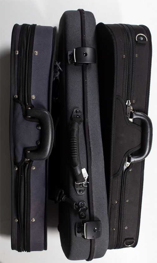 Three half-size and two quarter-size violin cases