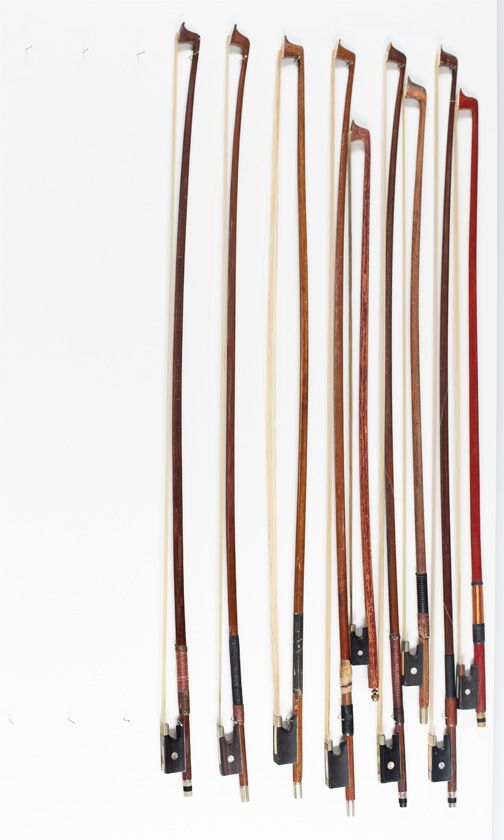 Six violin bows and three child's violin bows