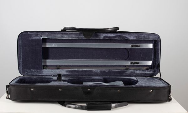 A pair of black rectangular violin cases, one branded Gewa
