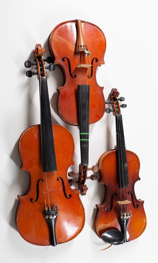 Five violins, various sizes