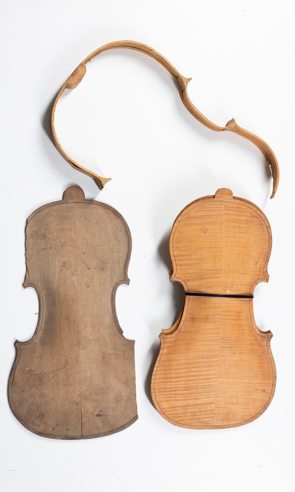 A collection of broken violins