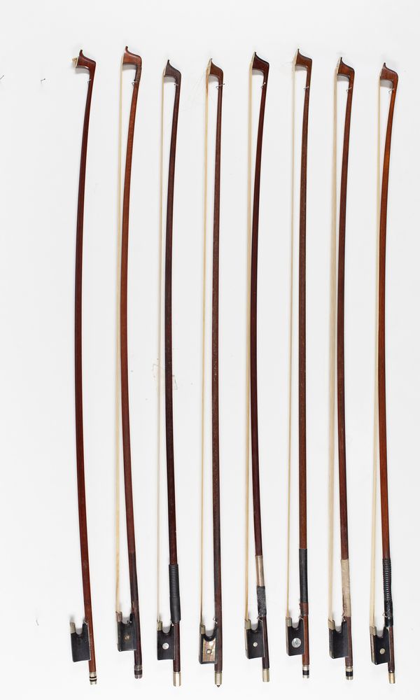 Eight violin bows of varying lengths