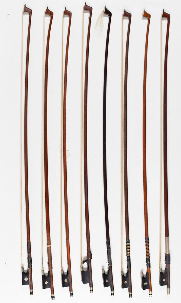 Eight violin bows of varying lengths