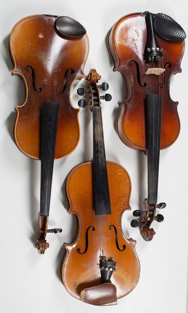 Three child's violins