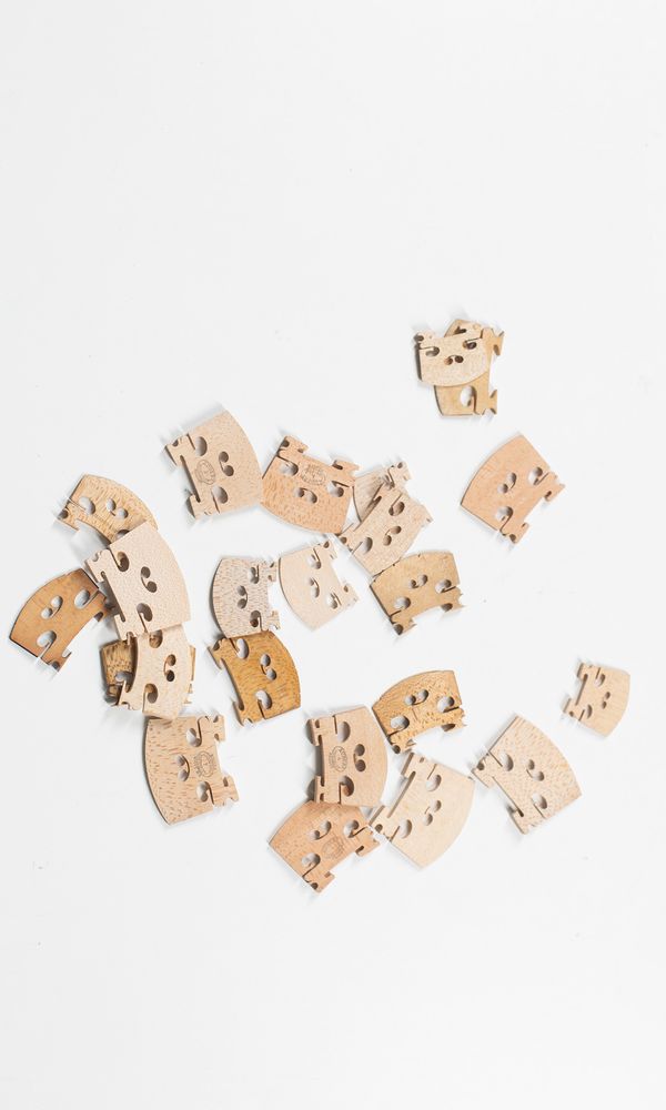 Twenty two violin bridges, various sizes