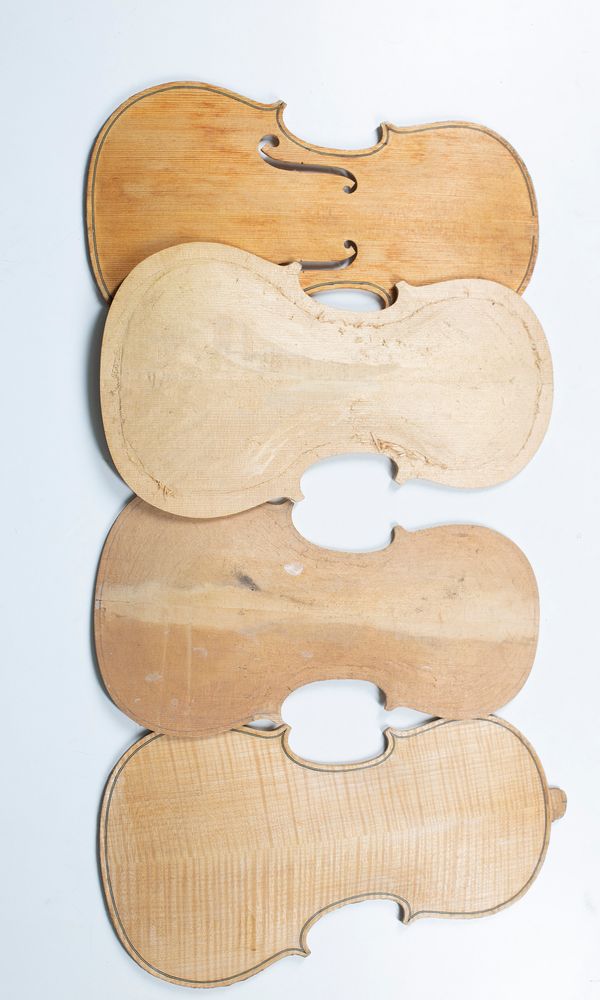 Three violin tables and one violin back