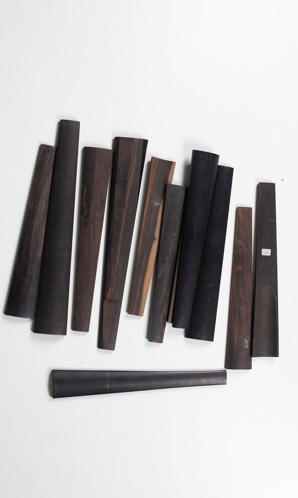 Twelve violin fingerboards, various sizes
