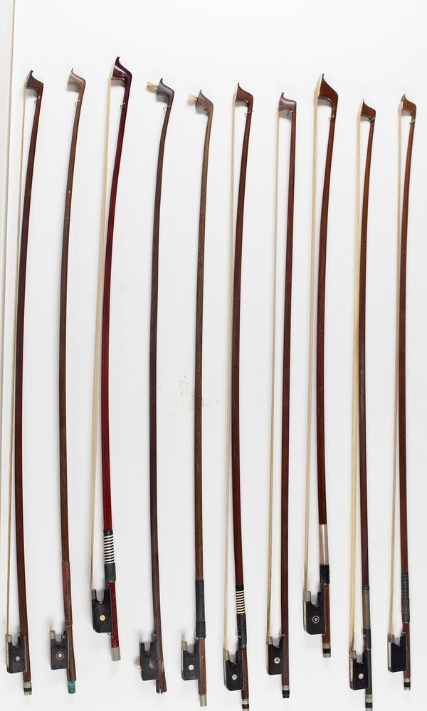 A bundle of eight violin bows and two cello bows, varying lengths