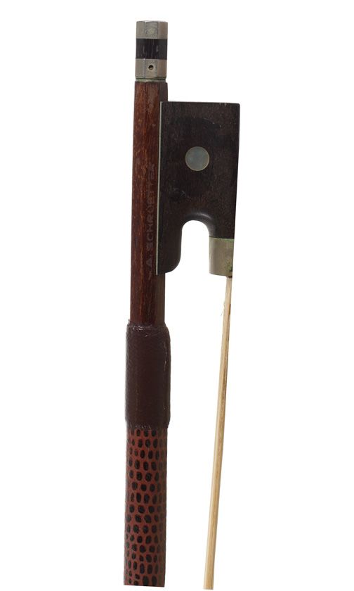A nickel-mounted violin bow, branded Schnetter
