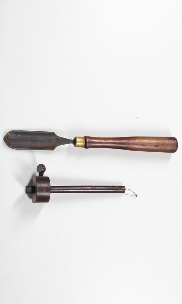 A large chisel and another tool from the W. E. Hill & Sons workshop