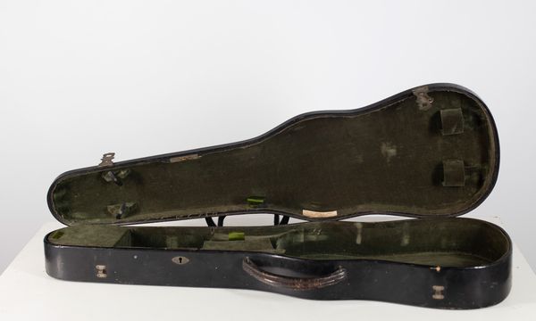 A violin case, branded W. E. Hill & Son