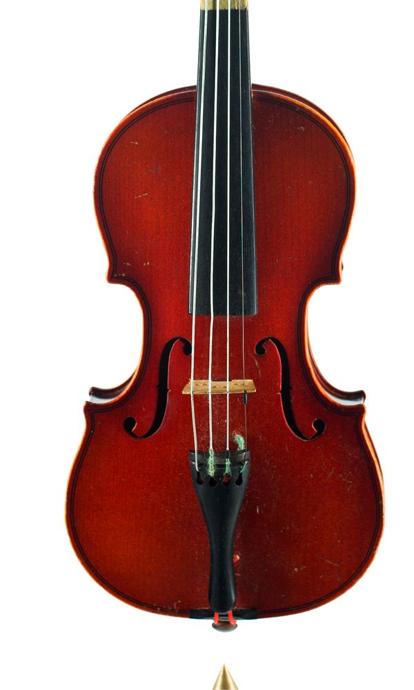 A child's violin labelled Suzuki