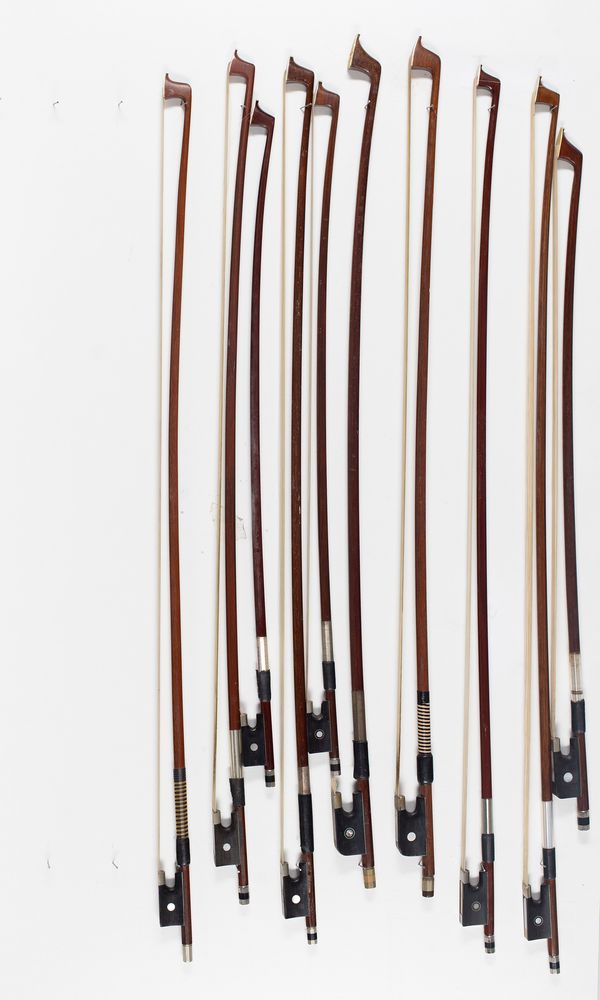 Seven violin bows and three bow sticks, varying lengths