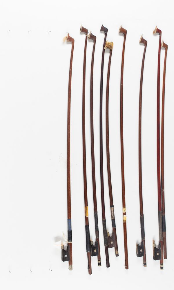 Nine child's size violin bows of varying lengths