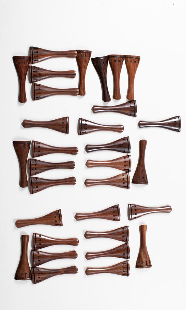 Thirty-one rosewood tailpieces, various sizes